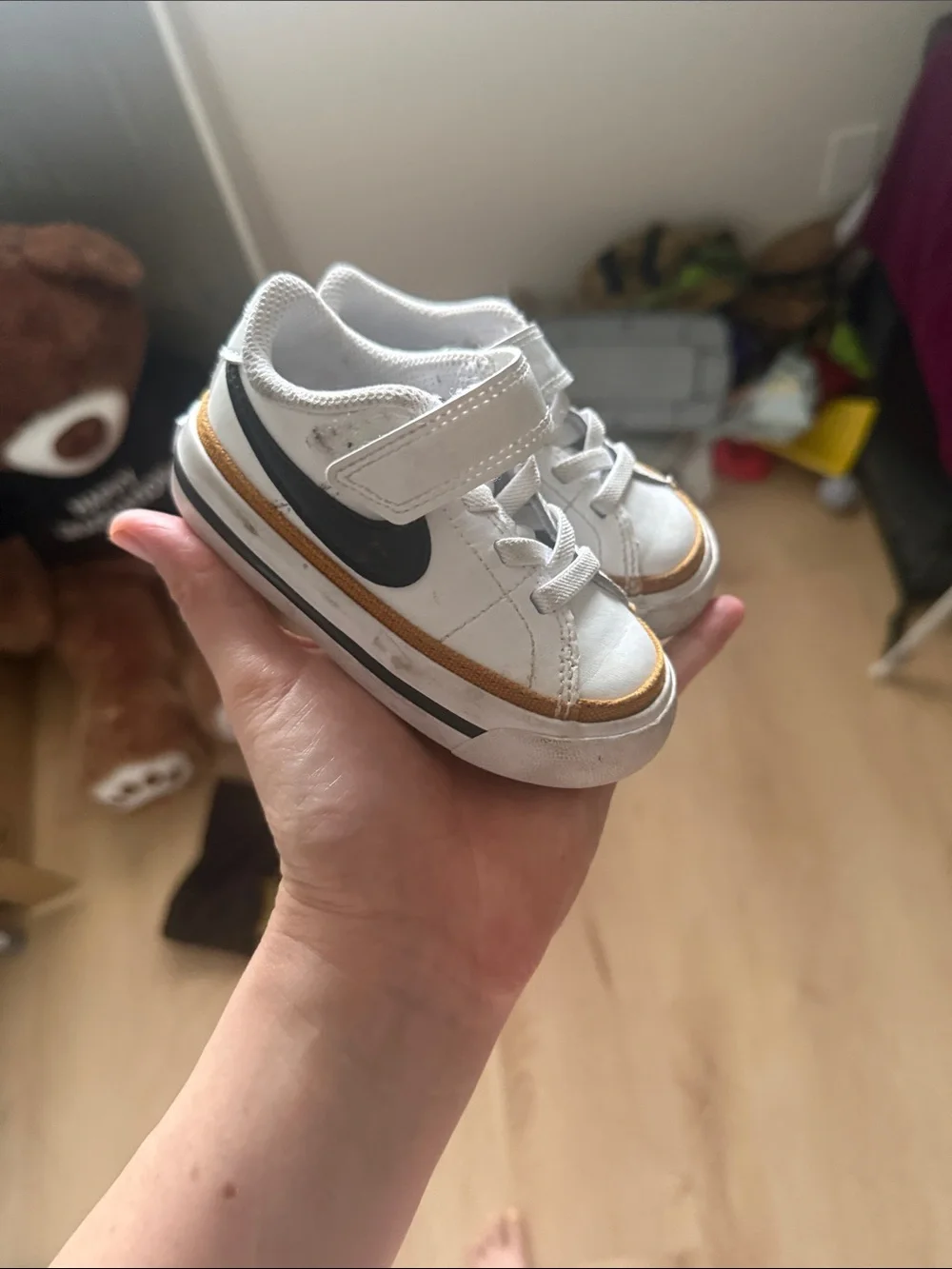 Nike Kids White Sneakers with Black Swoosh and Brown Trim